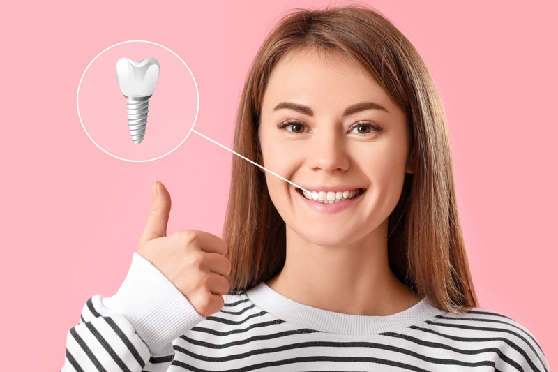 a woman smiling showing her dental implants with a zoomed in photo highlighting it